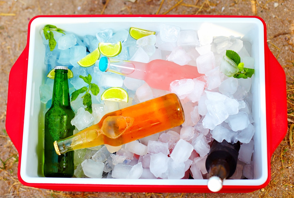 Colourful cold drinks with cubes in a container