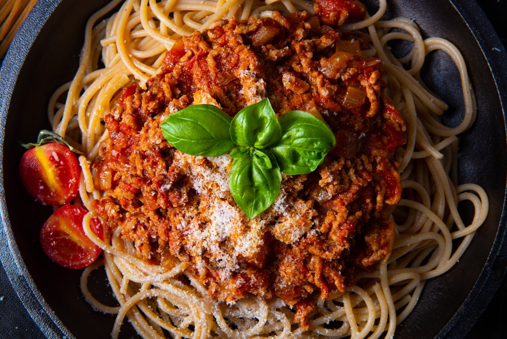spaghetti in tomato sauce topped with herbs