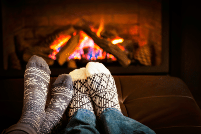stockinged feet near the fireplace