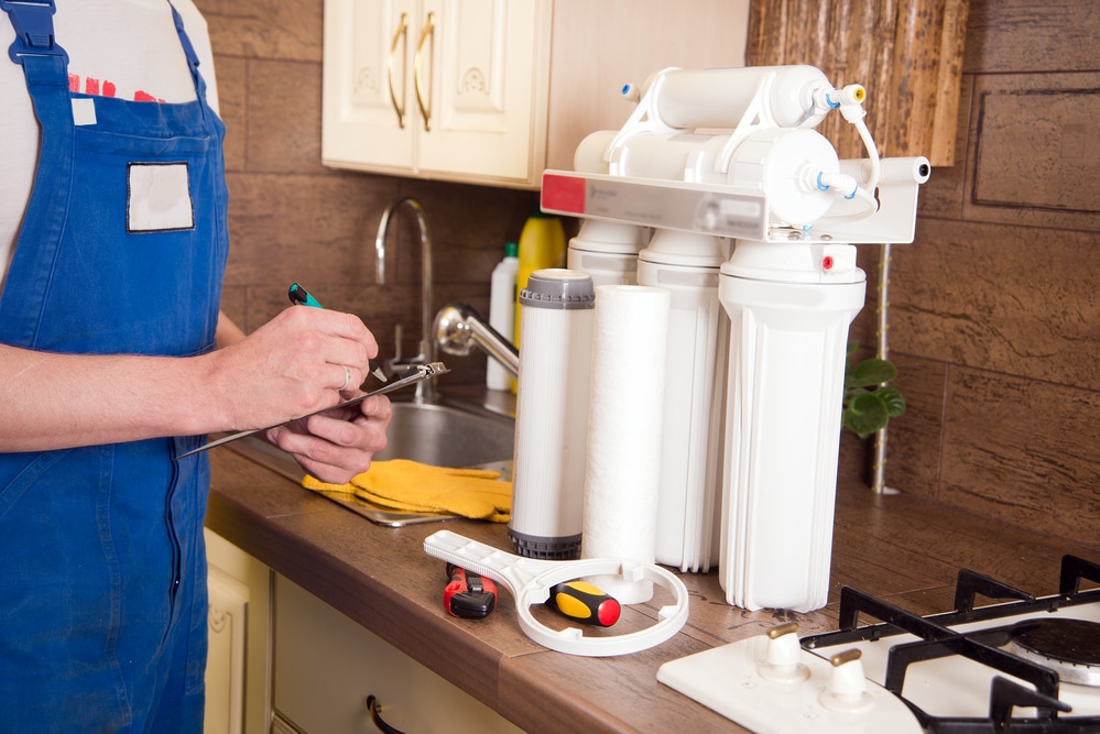 a plumber preparing to install a reverse osmosis system